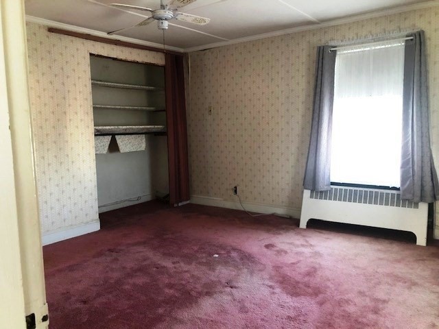 165 11th Street Lowell, MA 01850 - Photo 16 of 21 a view of an empty room with a window