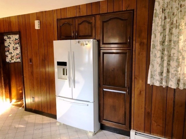 165 11th Street Lowell, MA 01850 - Photo 8 of 21 a white refrigerator freezer and a stove sitting inside of a refrigerator