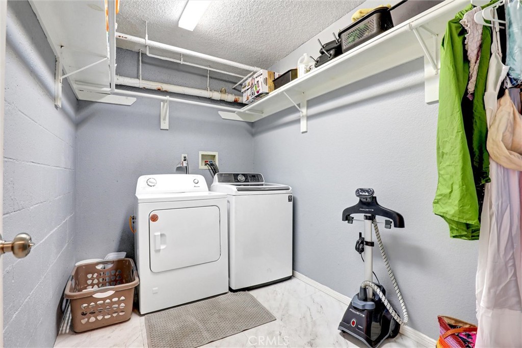 533 Walnut Avenue, Unit 7 Long Beach, CA 90802 - Photo 15 of 43 a view of storage and utility room with washer and dryer
