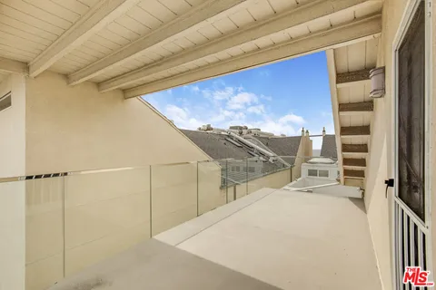 a view of a building with sitting area