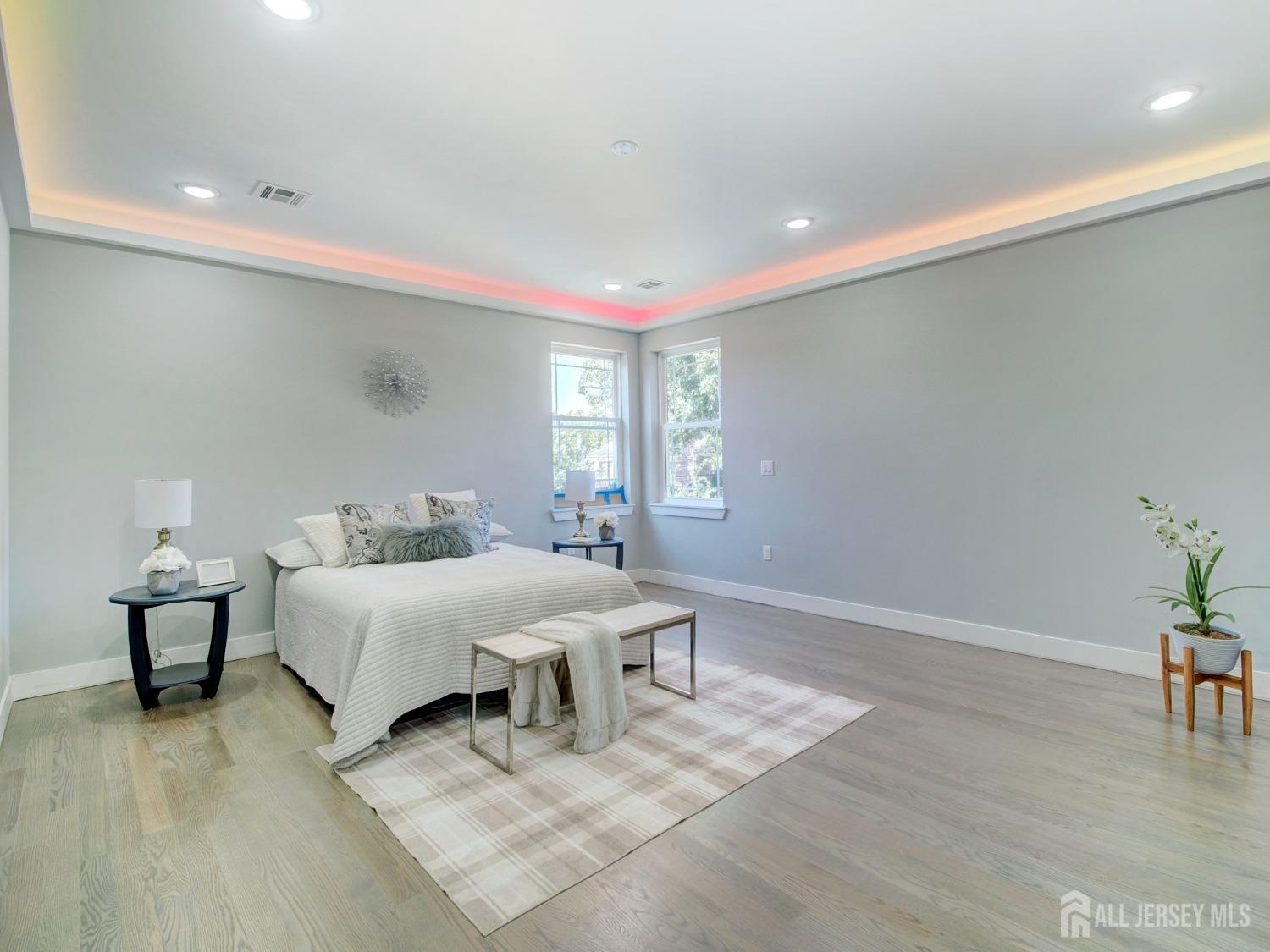 24 Stiles Road Edison, NJ 08817 - Photo 29 of 36 a spacious bedroom with a bed and window