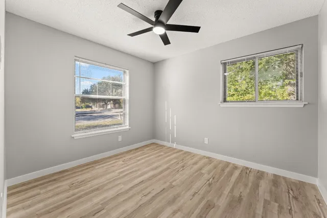 a view of an empty room with a window