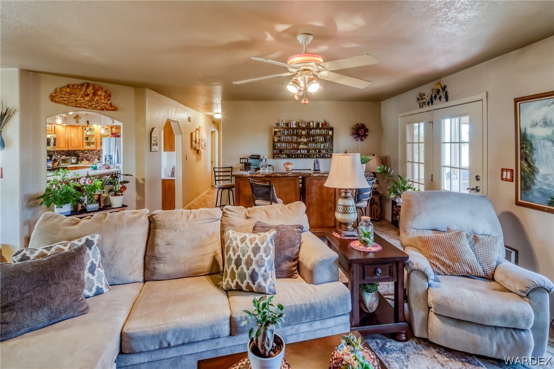 4150 Dragoon Road Golden Valley, AZ 86413 - Photo 12 of 49 a living room with furniture and a large window