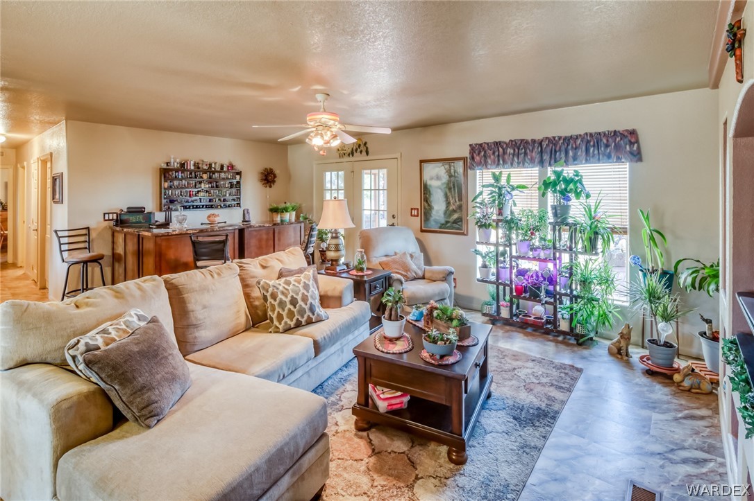 4150 Dragoon Road Golden Valley, AZ 86413 - Photo 13 of 49 a living room with furniture and a dining table