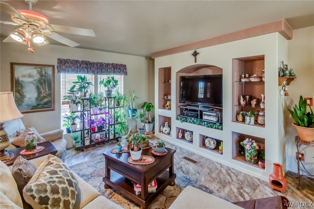 4150 Dragoon Road Golden Valley, AZ 86413 - Photo 14 of 49 a living room with furniture and a fireplace