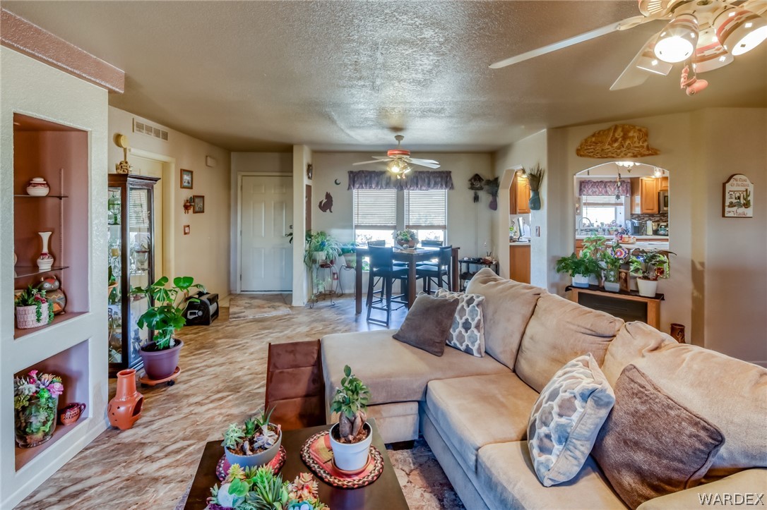 4150 Dragoon Road Golden Valley, AZ 86413 - Photo 15 of 49 a living room with furniture and wooden floor