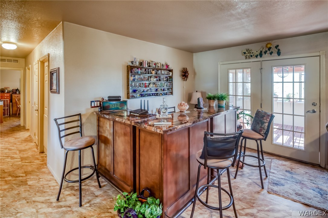 4150 Dragoon Road Golden Valley, AZ 86413 - Photo 22 of 49 a room with chairs a table and chairs in it