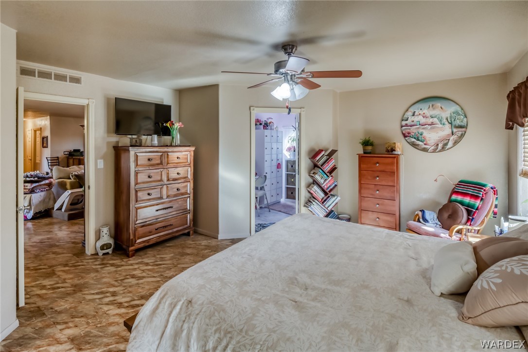 4150 Dragoon Road Golden Valley, AZ 86413 - Photo 25 of 49 a bedroom with furniture and a mirror
