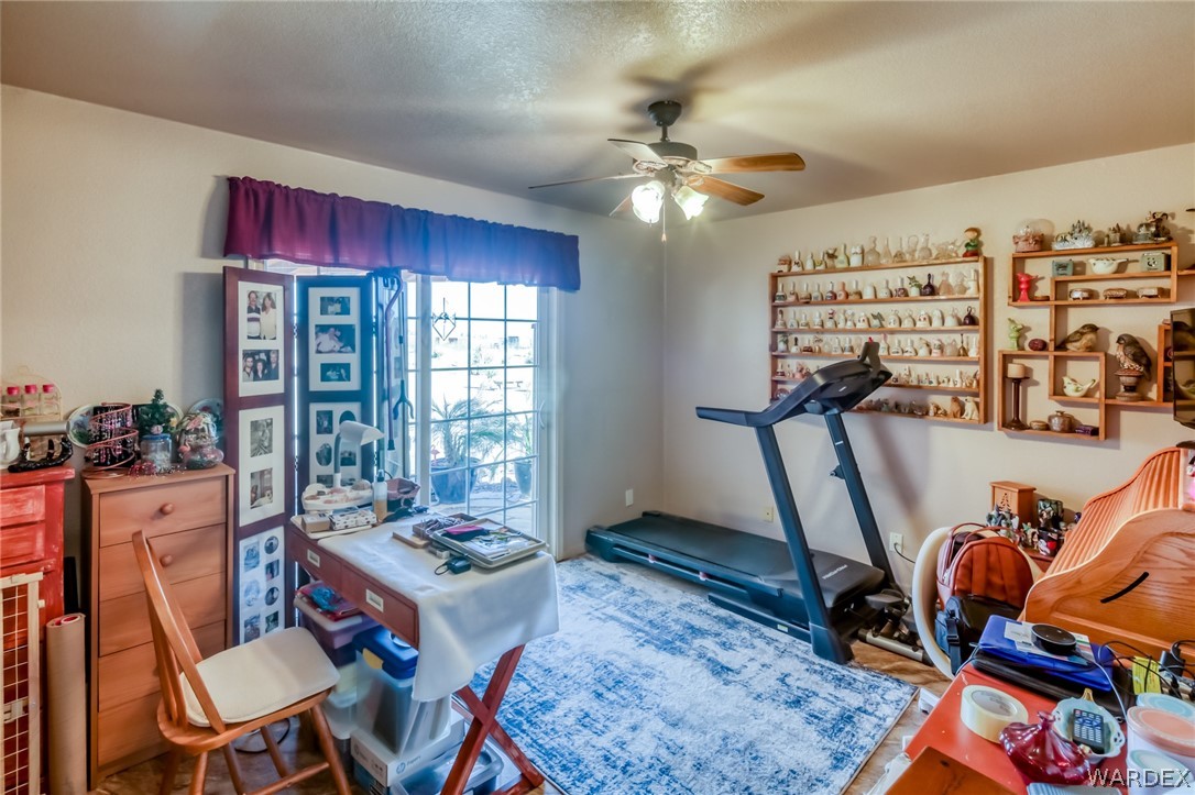 4150 Dragoon Road Golden Valley, AZ 86413 - Photo 28 of 49 a living room with furniture a rug and a window
