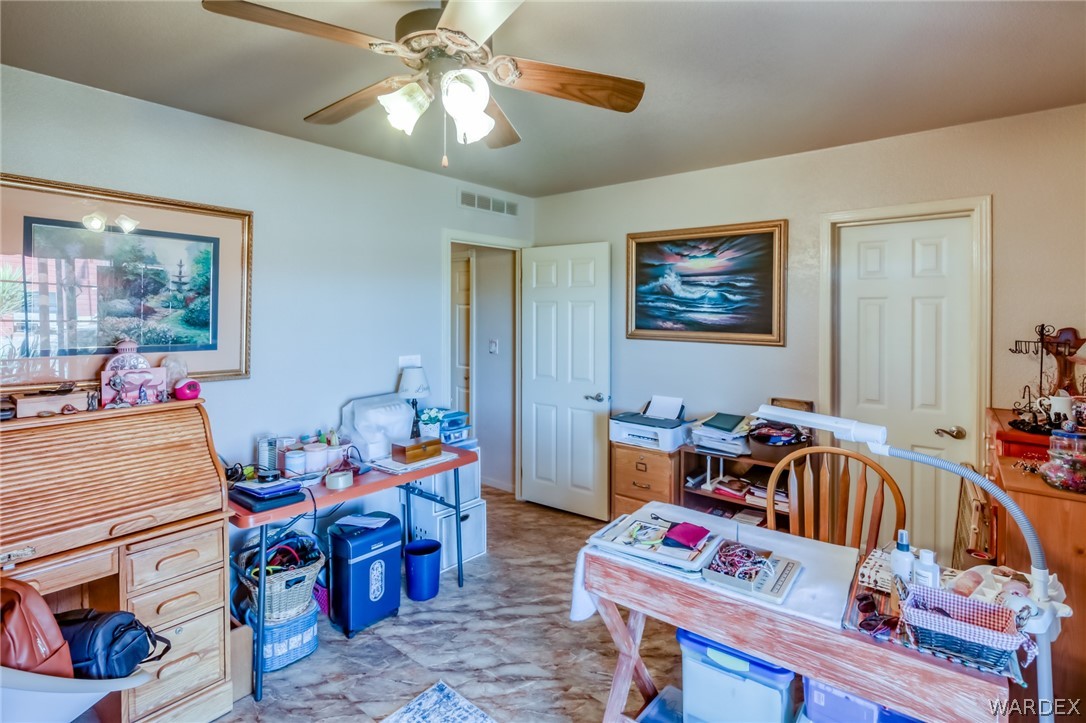 4150 Dragoon Road Golden Valley, AZ 86413 - Photo 29 of 49 a living room with furniture and a baby crib