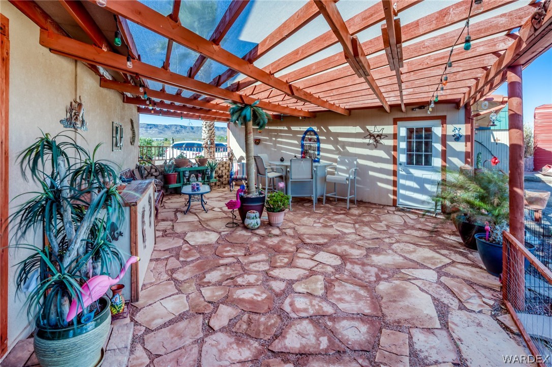 4150 Dragoon Road Golden Valley, AZ 86413 - Photo 41 of 49 a view of a porch with a potted plant