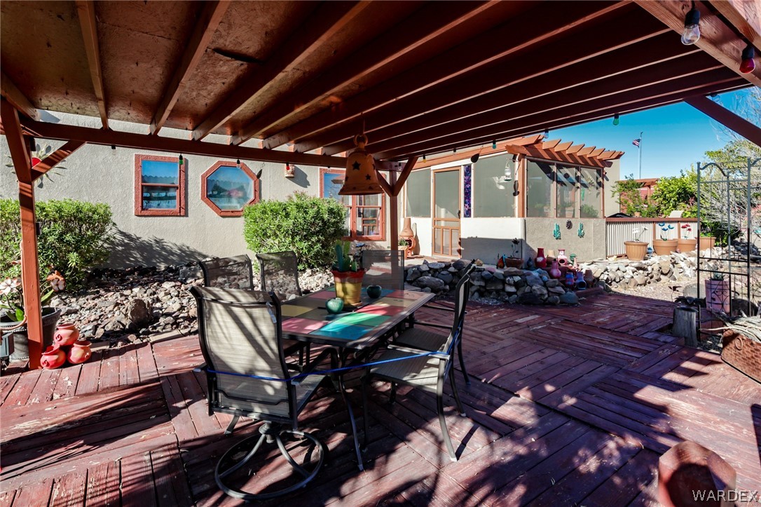4150 Dragoon Road Golden Valley, AZ 86413 - Photo 43 of 49 a view of a porch with chairs and potted plants