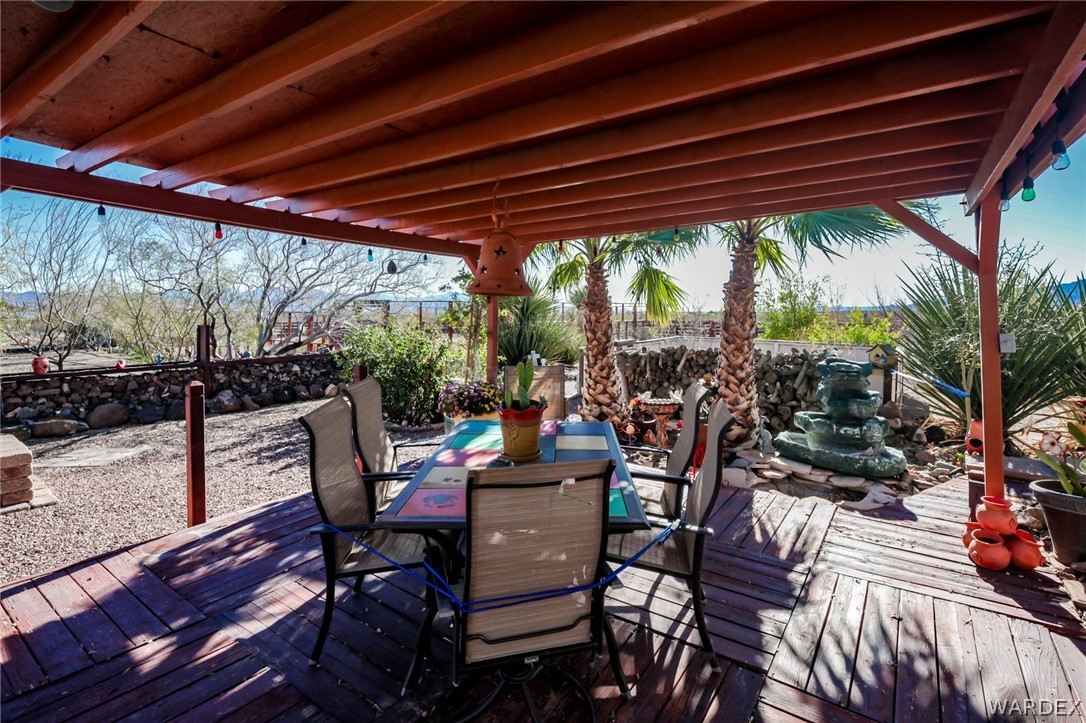 4150 Dragoon Road Golden Valley, AZ 86413 - Photo 45 of 49 a view of a patio with table and chairs and potted plants