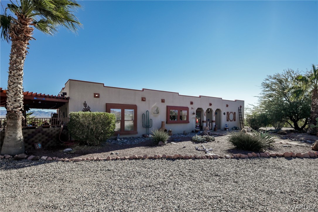 4150 Dragoon Road Golden Valley, AZ 86413 - Photo 6 of 49 a backyard of a house with barbeque oven and outdoor seating