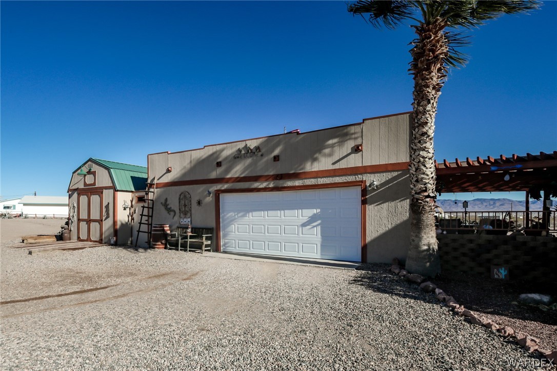 4150 Dragoon Road Golden Valley, AZ 86413 - Photo 9 of 49 a view of a building with a yard