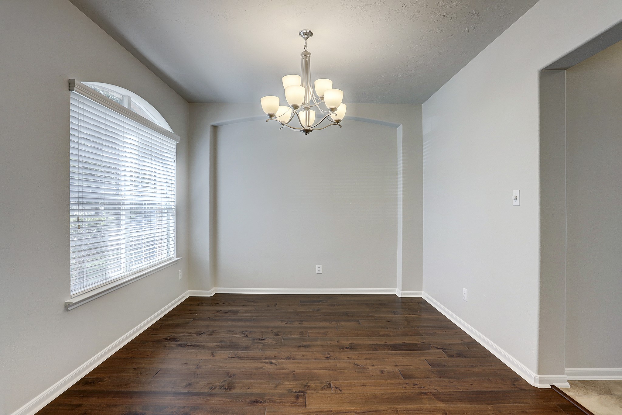 12331 Crescent Mountain Lane Humble, TX 77346 - Photo 11 of 34 a view of an empty room with wooden floor
