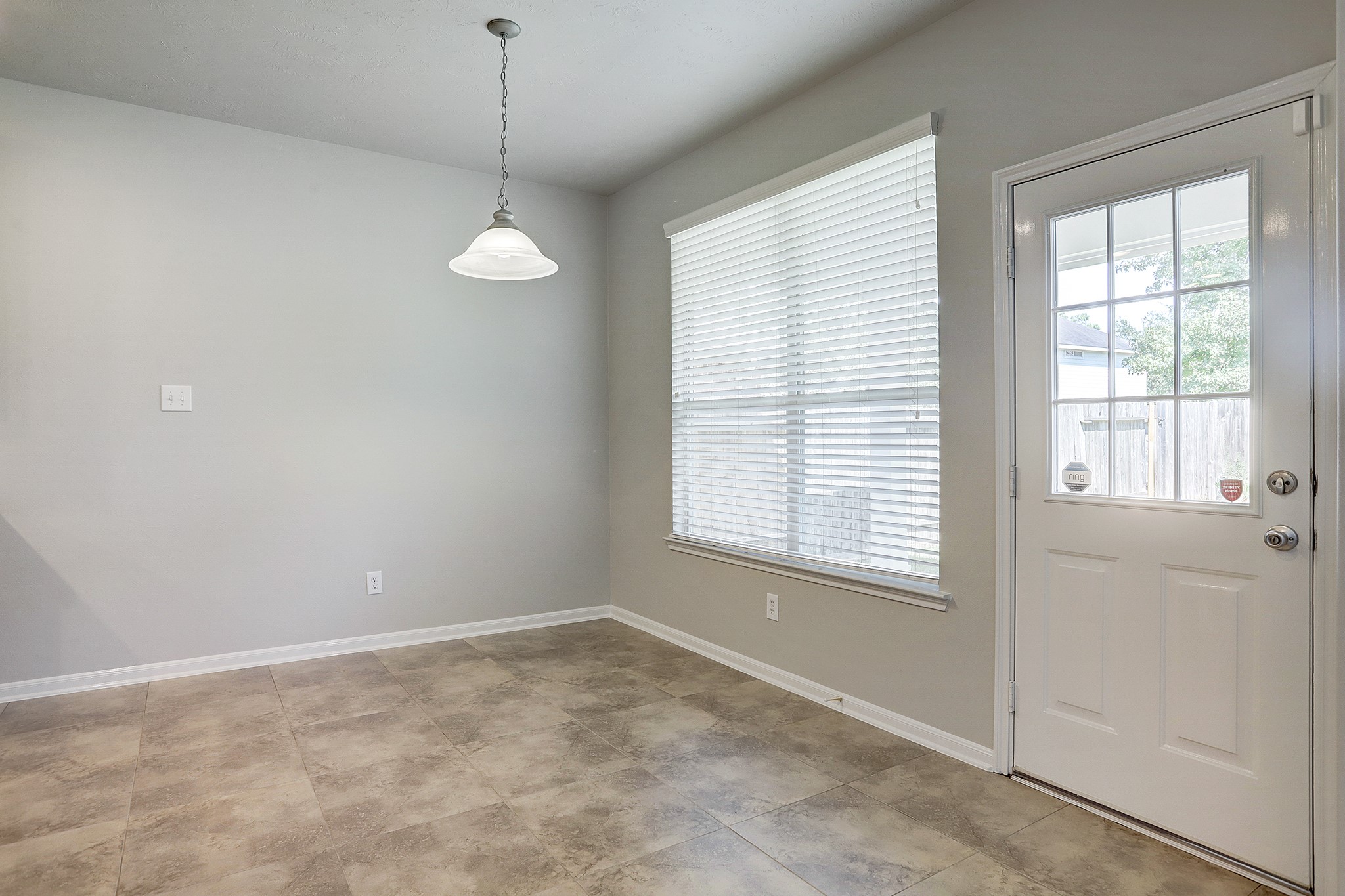12331 Crescent Mountain Lane Humble, TX 77346 - Photo 18 of 34 a view of an empty room with a window