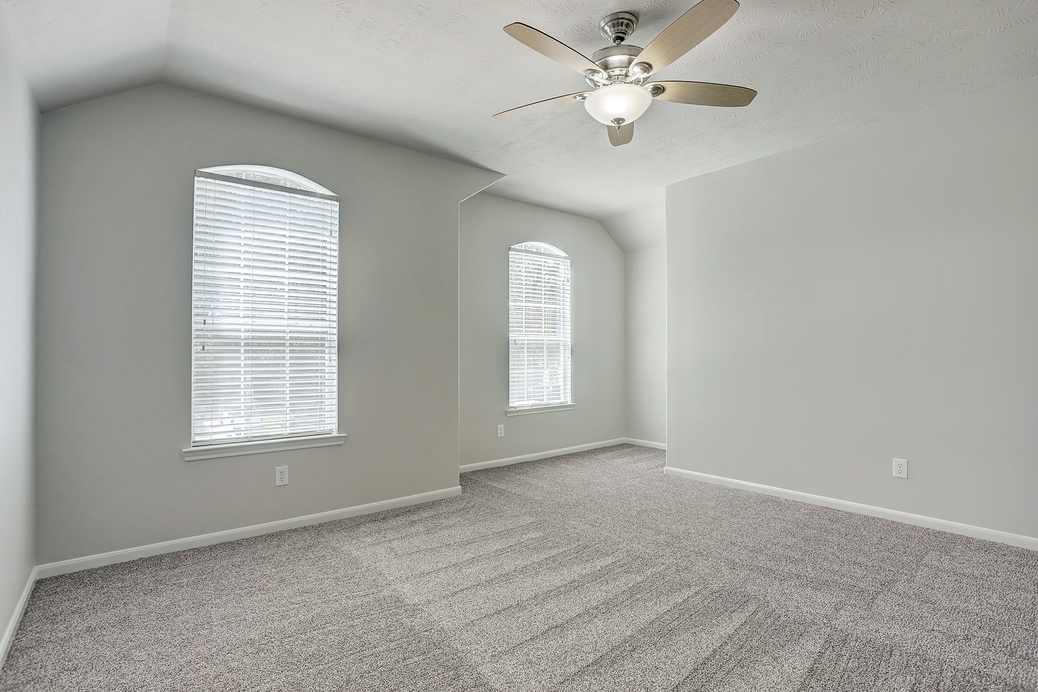 12331 Crescent Mountain Lane Humble, TX 77346 - Photo 25 of 34 a view of a room with a ceiling fan and a window