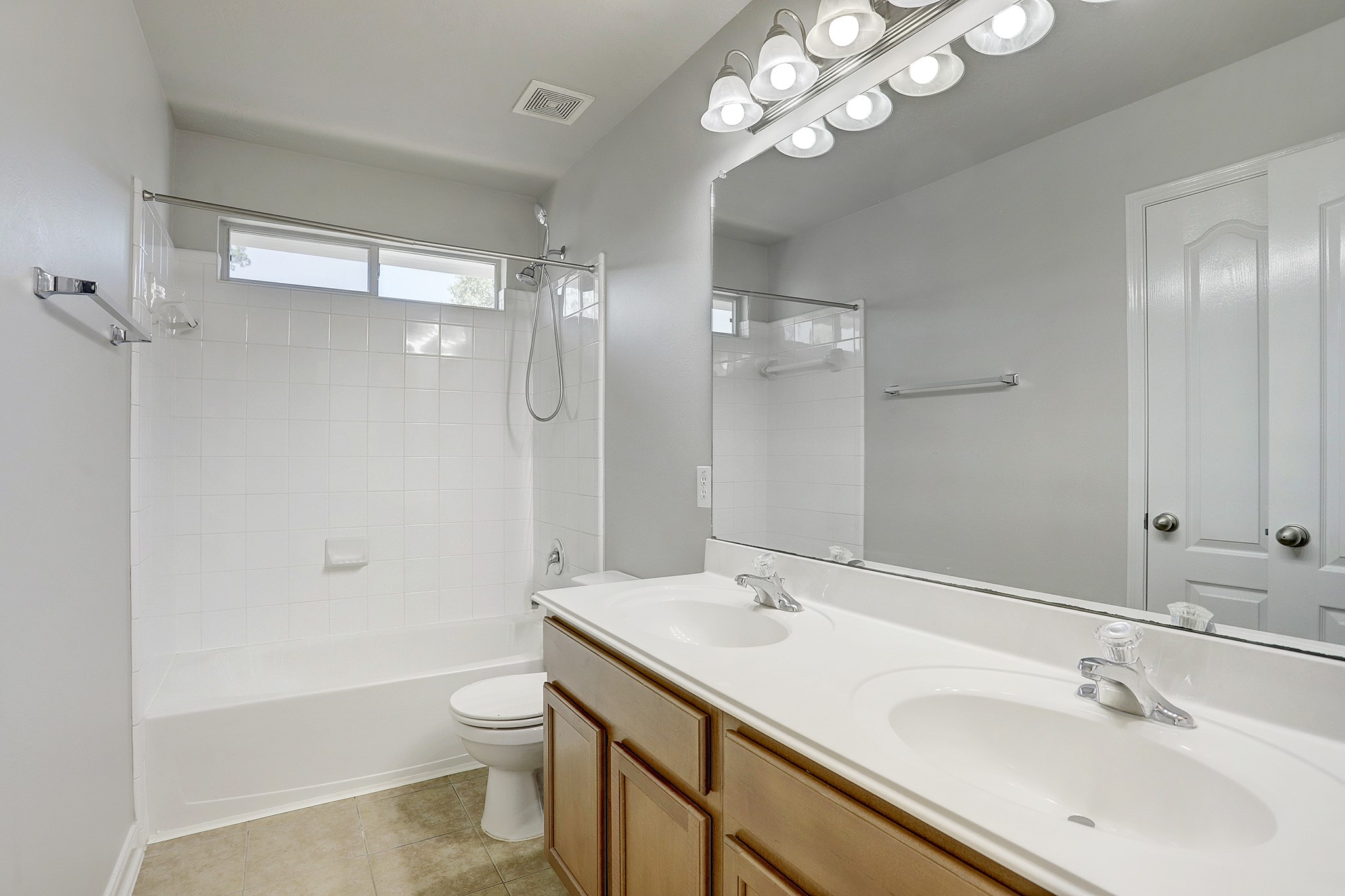12331 Crescent Mountain Lane Humble, TX 77346 - Photo 28 of 34 a bathroom with a sink a toilet a mirror and shower