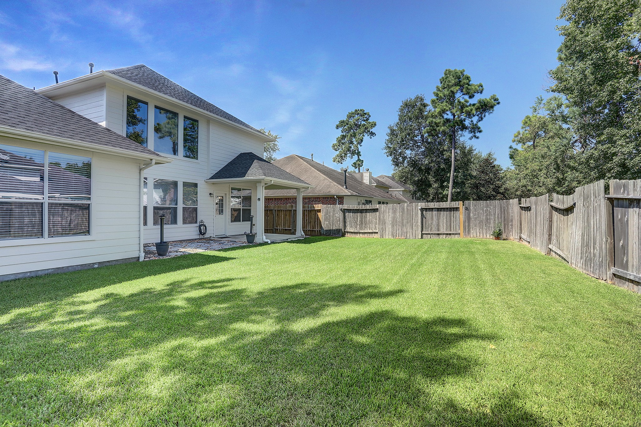 12331 Crescent Mountain Lane Humble, TX 77346 - Photo 33 of 34 a front view of a house with a yard and trees