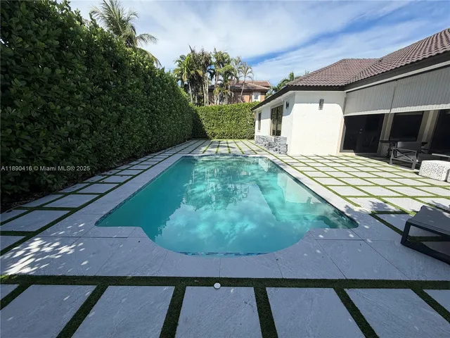 a view of a back yard of the house