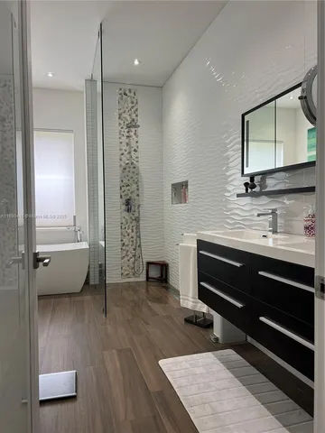 a bathroom with a double vanity sink and a mirror