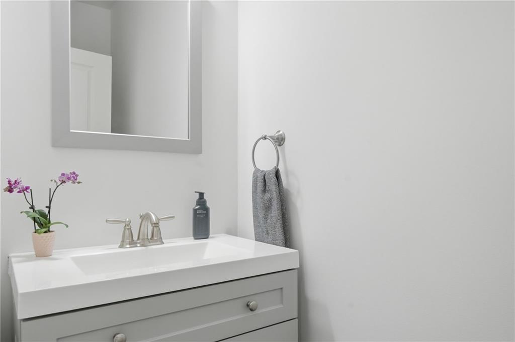 246 Manous Way Canton, GA 30115 - Photo 14 of 38 a bathroom with a sink vanity and a mirror