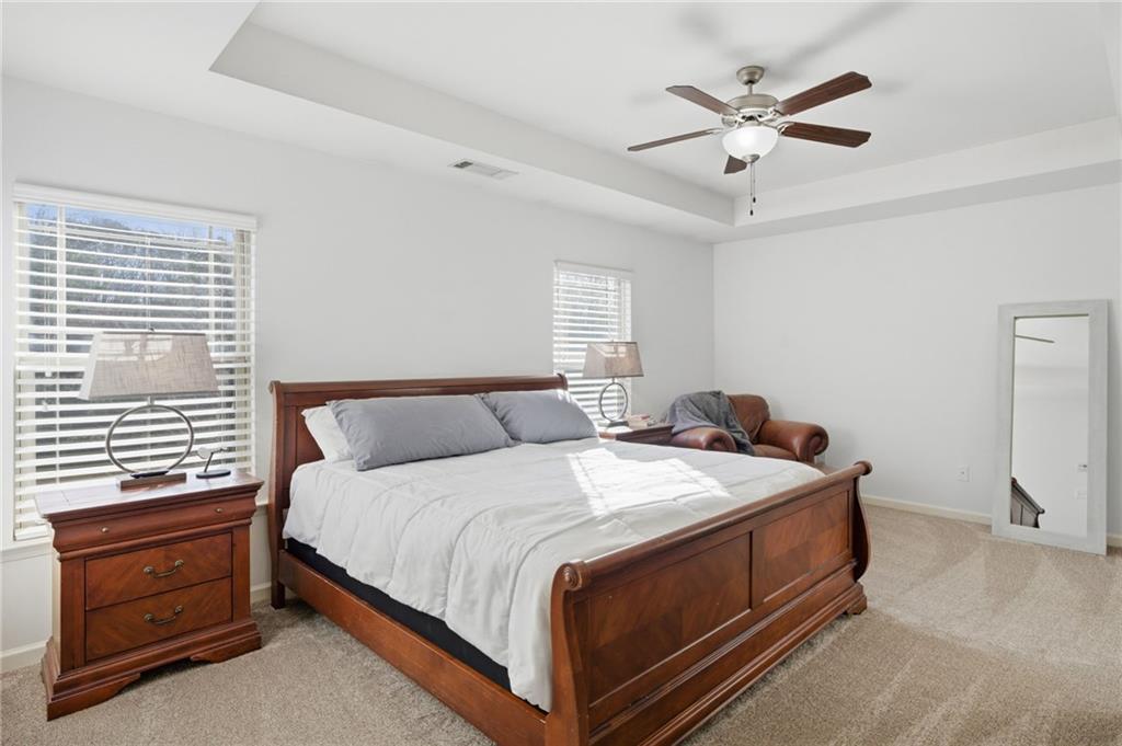246 Manous Way Canton, GA 30115 - Photo 15 of 38 a bedroom with a bed and a window