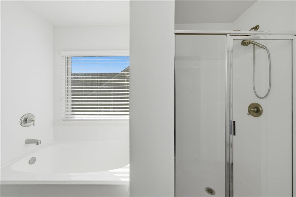 246 Manous Way Canton, GA 30115 - Photo 19 of 38 a bathroom with a shower