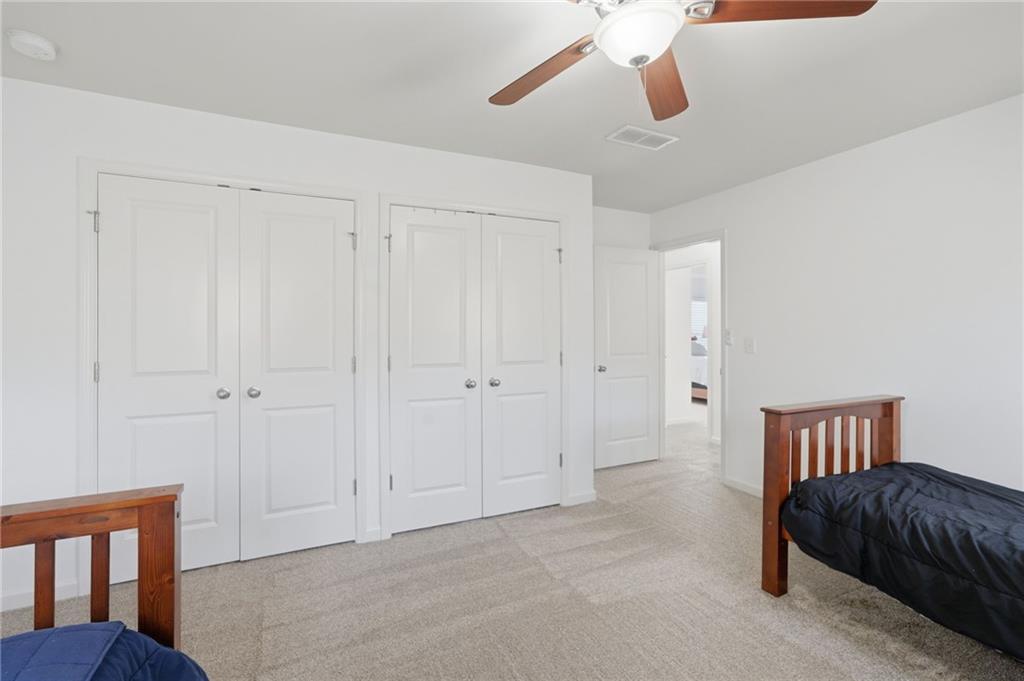 246 Manous Way Canton, GA 30115 - Photo 22 of 38 a bedroom with furniture and window