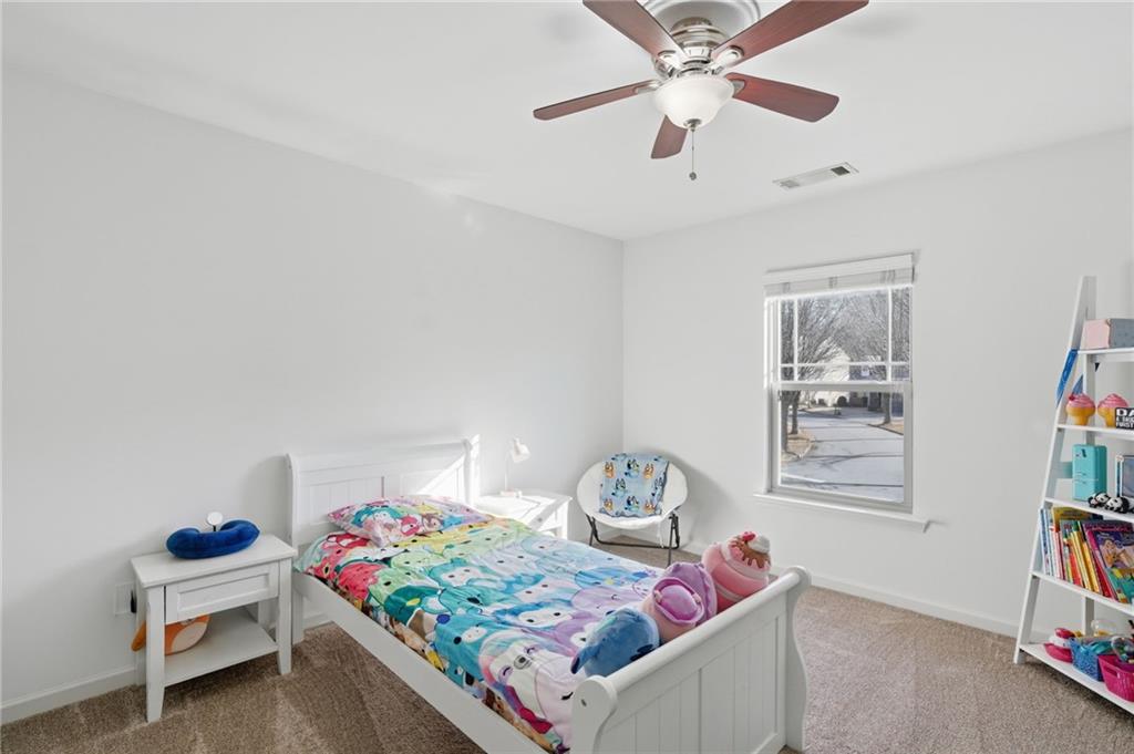 246 Manous Way Canton, GA 30115 - Photo 23 of 38 a living room with baby crib furniture and a window