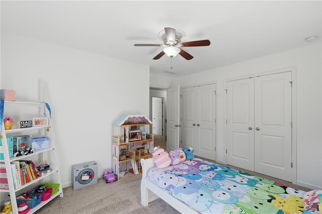 246 Manous Way Canton, GA 30115 - Photo 24 of 38 a bedroom with a bed and closet
