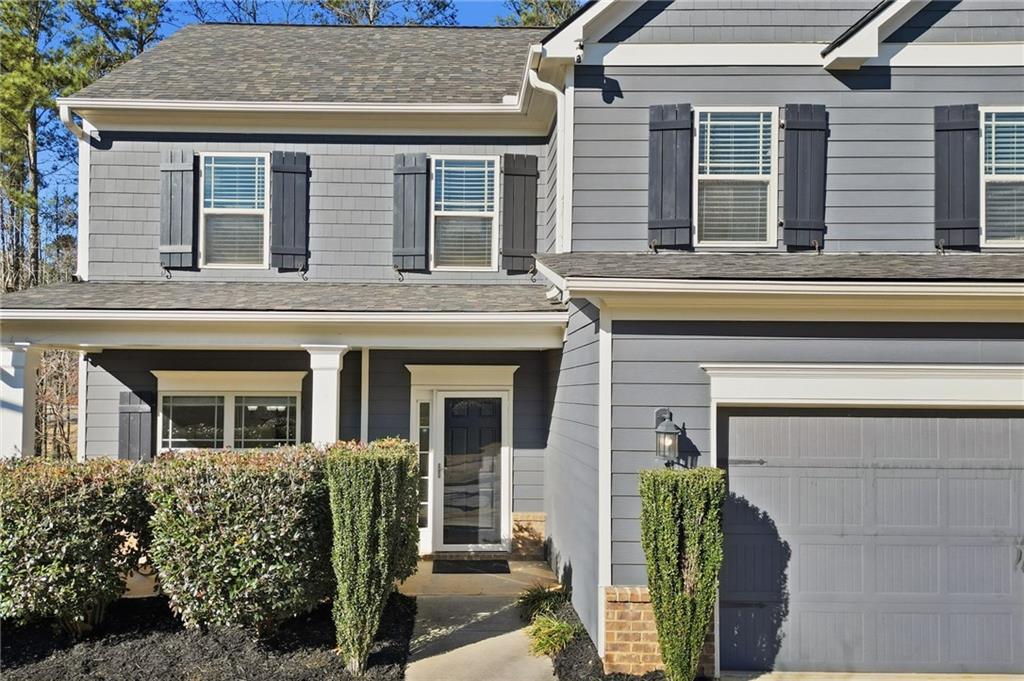 246 Manous Way Canton, GA 30115 - Photo 30 of 38 a front view of a house with garden