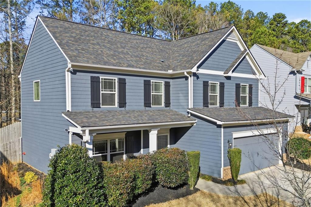 246 Manous Way Canton, GA 30115 - Photo 31 of 38 a aerial view of a house with yard and trees in the background