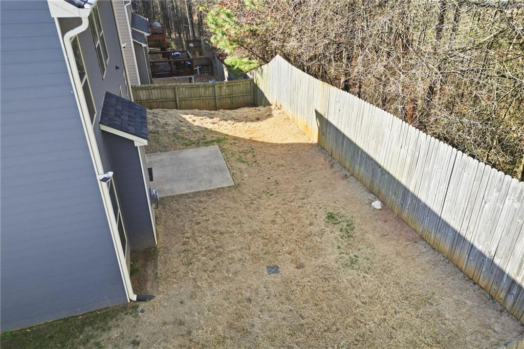 246 Manous Way Canton, GA 30115 - Photo 35 of 38 a view of balcony with wooden floor and fence