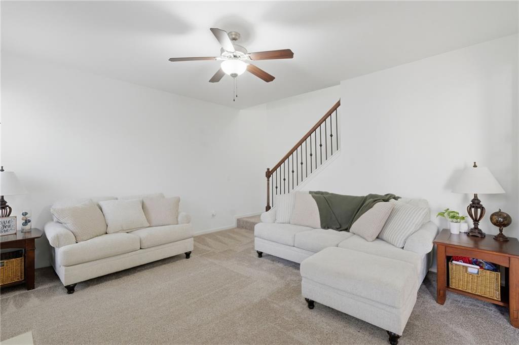 246 Manous Way Canton, GA 30115 - Photo 8 of 38 a living room with furniture and white walls