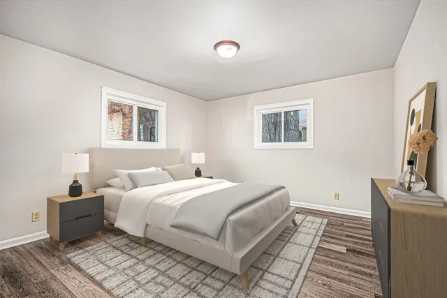 a bedroom with a large bed and a window