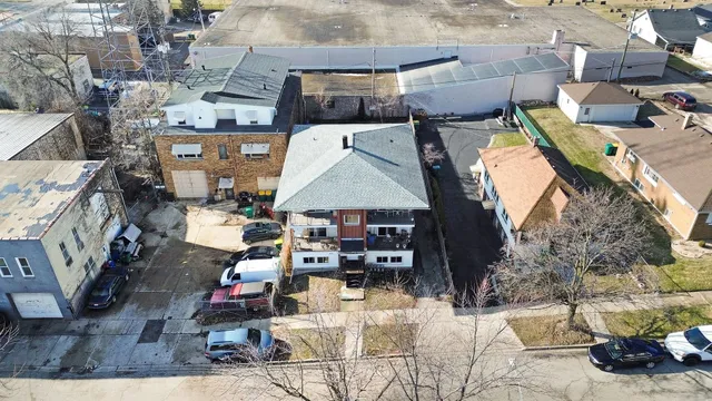 an aerial view of a house with a patio