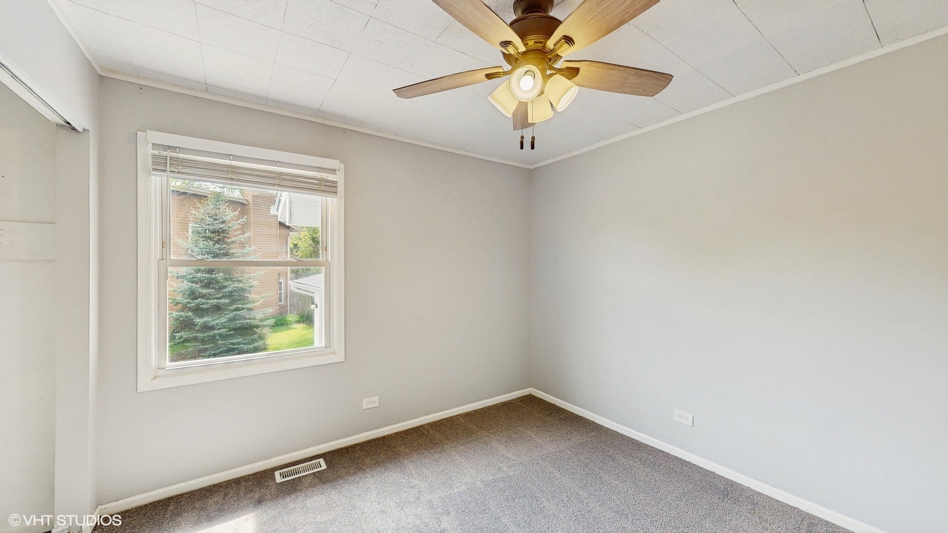 2525 Ridge Road Aurora, IL 60504 - Photo 16 of 36 an empty room with a window and a fan