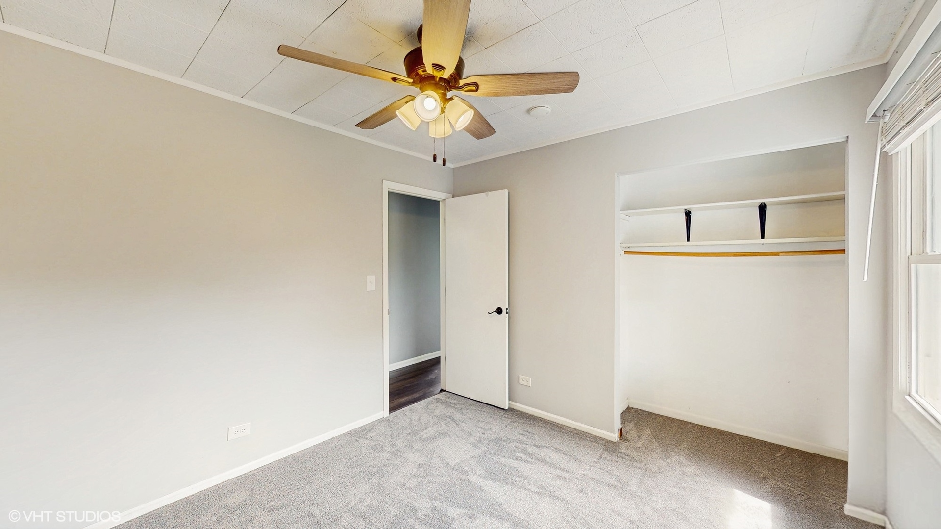 2525 Ridge Road Aurora, IL 60504 - Photo 17 of 36 an empty room with a fan and a ceiling fan