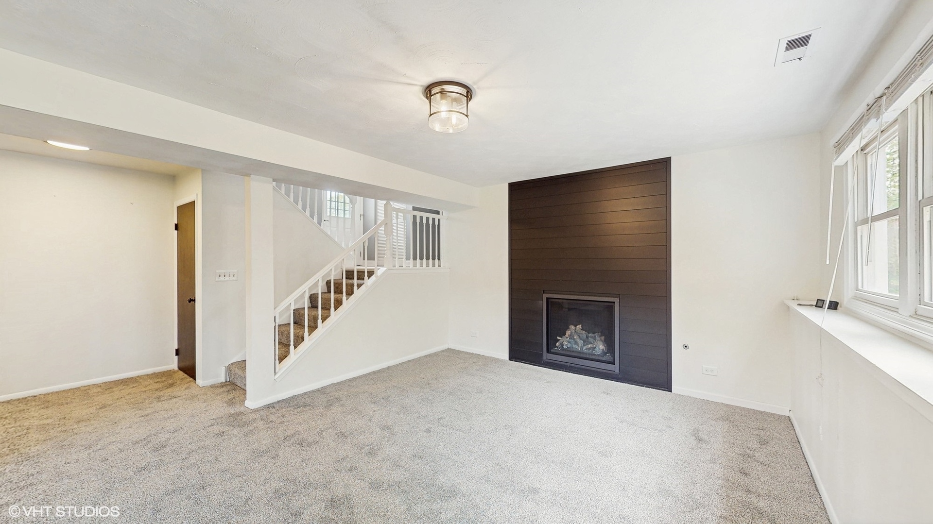 2525 Ridge Road Aurora, IL 60504 - Photo 19 of 36 a view of an empty room with a fireplace and a window