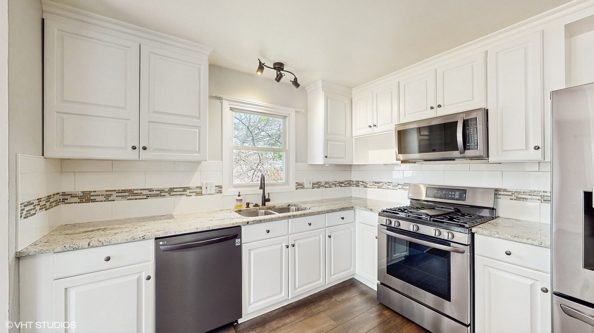 2525 Ridge Road Aurora, IL 60504 - Photo 4 of 36 a kitchen with white cabinets appliances and sink