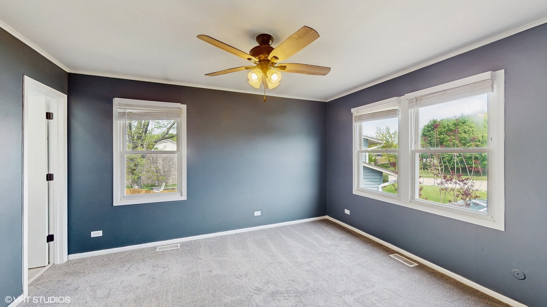 2525 Ridge Road Aurora, IL 60504 - Photo 10 of 36 a view of a livingroom with a window and a ceiling fan