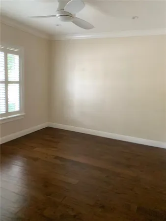 a view of a room with wooden floor and staircase