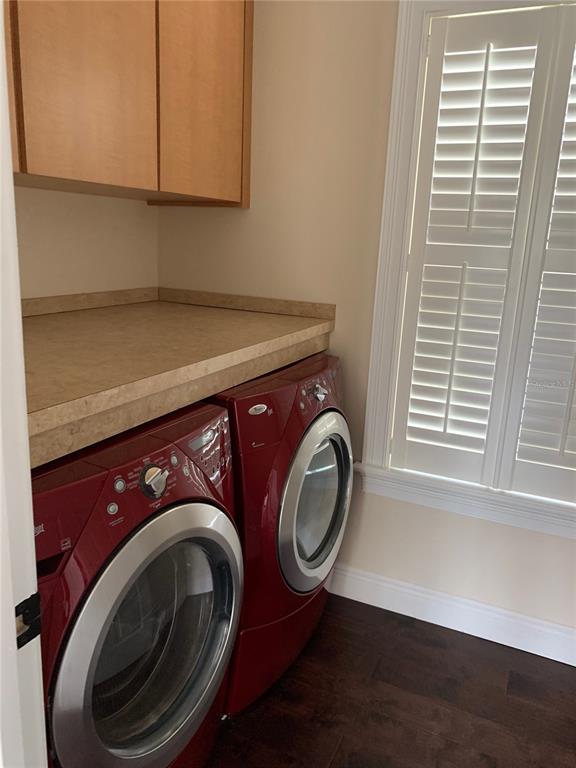 910 Pawstand Road Celebration, FL 34747 - Photo 16 of 33 a utility room with dryer and washer