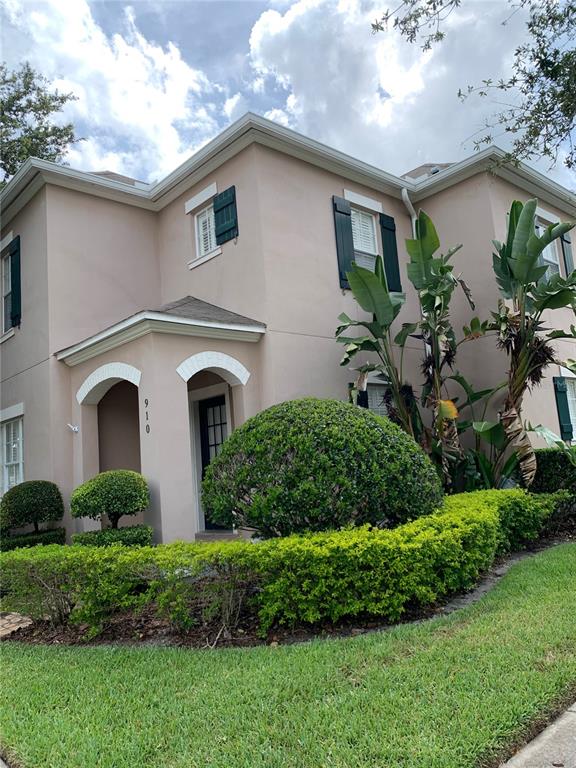 910 Pawstand Road Celebration, FL 34747 - Photo 2 of 33 a front view of a house with garden