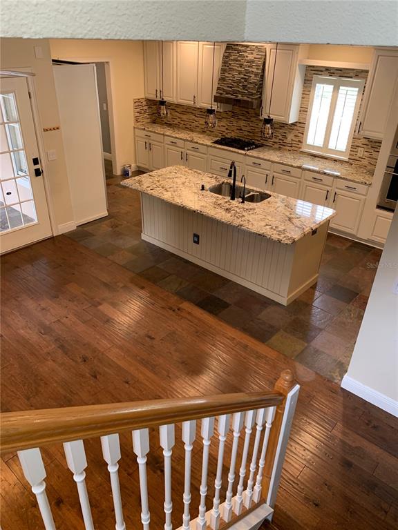 910 Pawstand Road Celebration, FL 34747 - Photo 24 of 33 a kitchen with sink refrigerator and window
