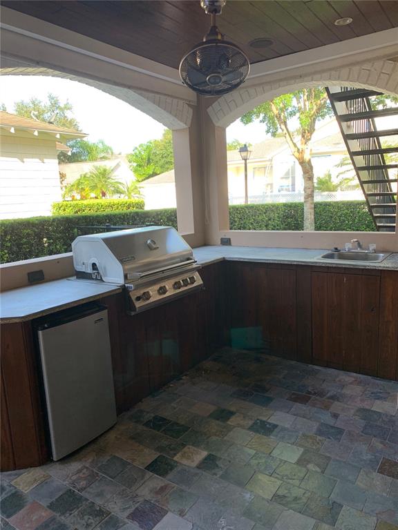 910 Pawstand Road Celebration, FL 34747 - Photo 29 of 33 a kitchen view with a stove