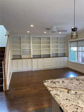 a view of a livingroom with wooden floor
