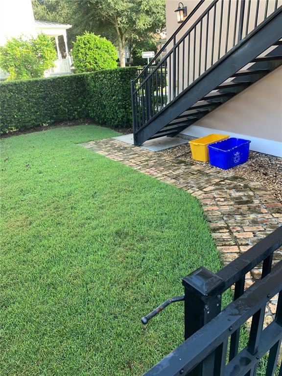 910 Pawstand Road Celebration, FL 34747 - Photo 31 of 33 a view of yard with deck and wooden fence